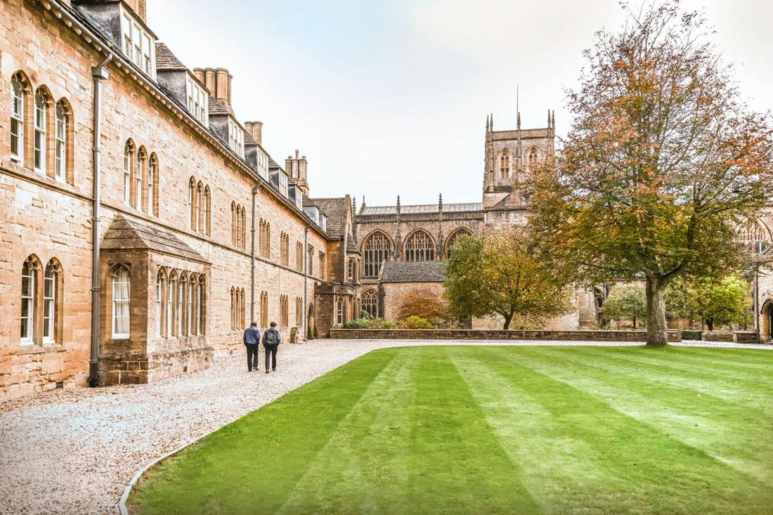 Sherborne Dorset: the courtyard lawn beneath the abbey